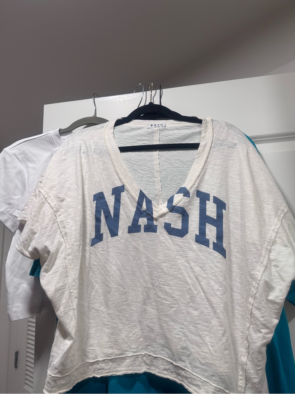 Nash Woman’s White V-Neck Graphic Tee